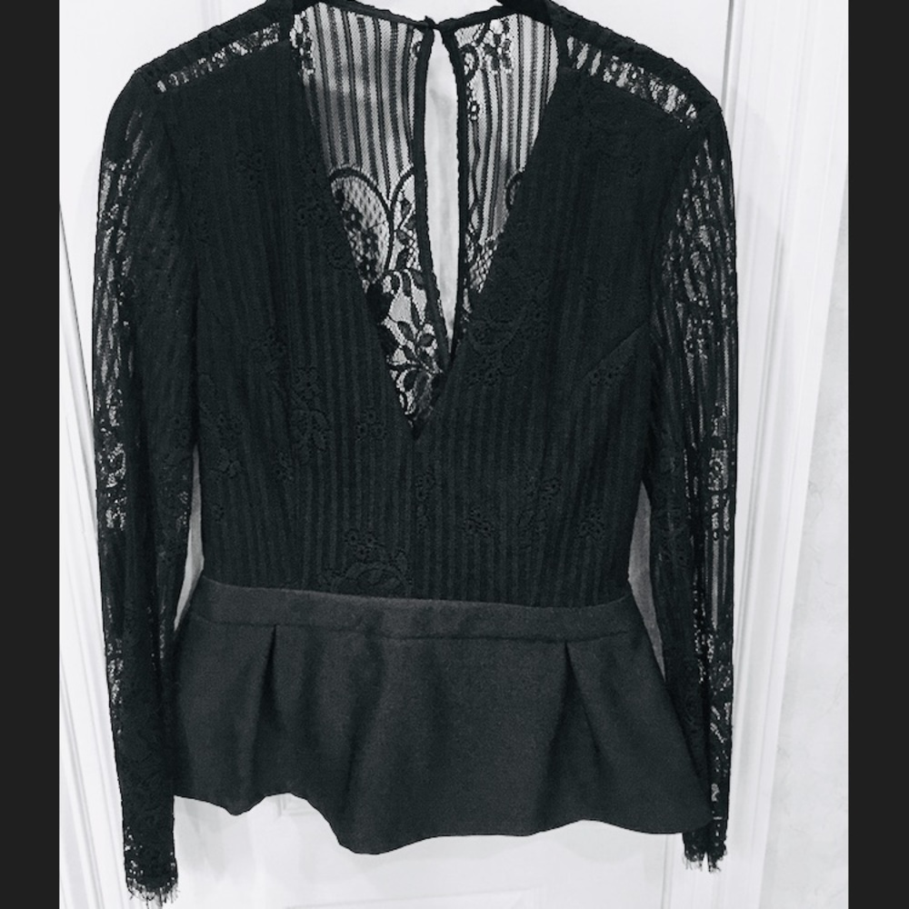 Plunging black lace peplum top